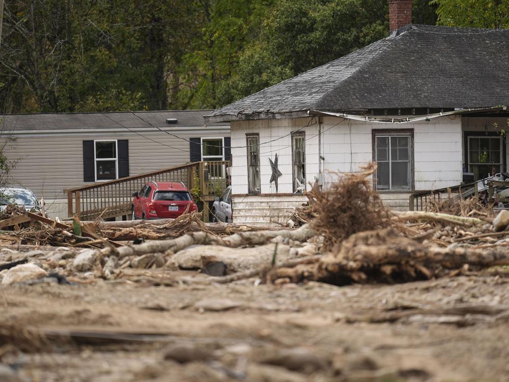 Homes lie in a debris field in the aftermath of Hurricane Helene, Thursday, Oct. 3, 2024, in Pensacola, N.C.