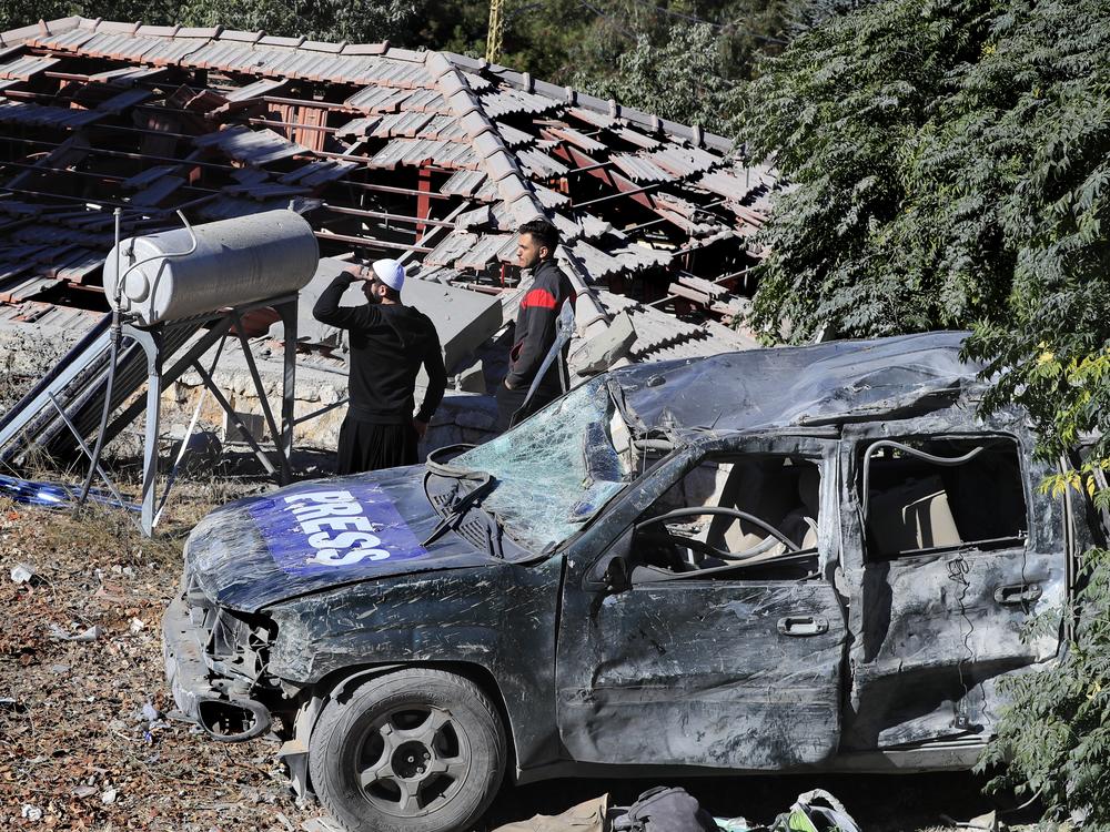 People observe the site where an Israeli airstrike hit a compound housing journalists, killing three media staffers from two different news agencies according to Lebanon's state-run National News Agency, in Hasbaya village, southeast Lebanon, on Oct. 25.
