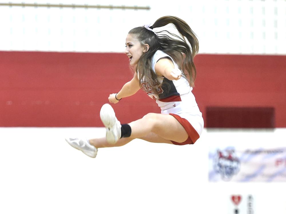 Fleetwood High School cheerleader Samantha Colelli, 17, a senior at Fleetwood, does a basket during halftime at a game in 2017. As cheerleading has become more ambitious over the last decade, it's also become riskier warn pediatricians.