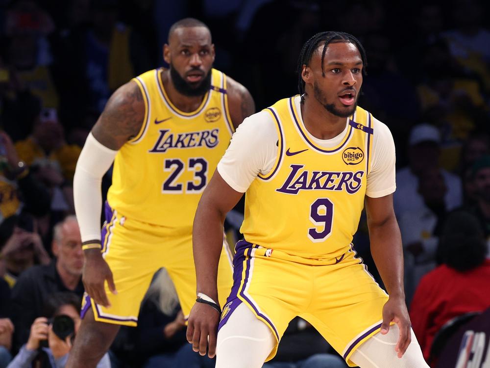 LeBron James, left, and Bronny James of the Lakers play during the second quarter against the Minnesota Timberwolves in Los Angeles on Tuesday.