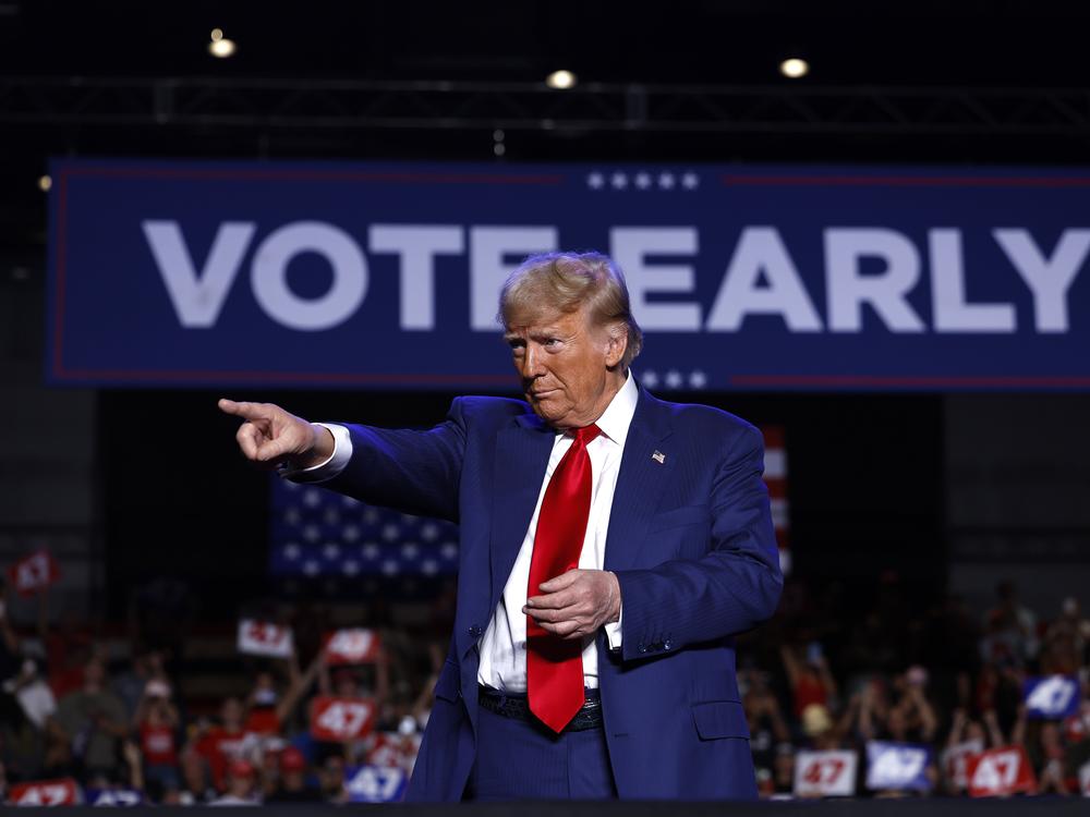 Former President Donald Trump speaks during a rally at Mullett Arena on Thursday in Tempe, Arizona. Trump travels to Texas on Friday, where he is scheduled to tape an interview with Joe Rogan.