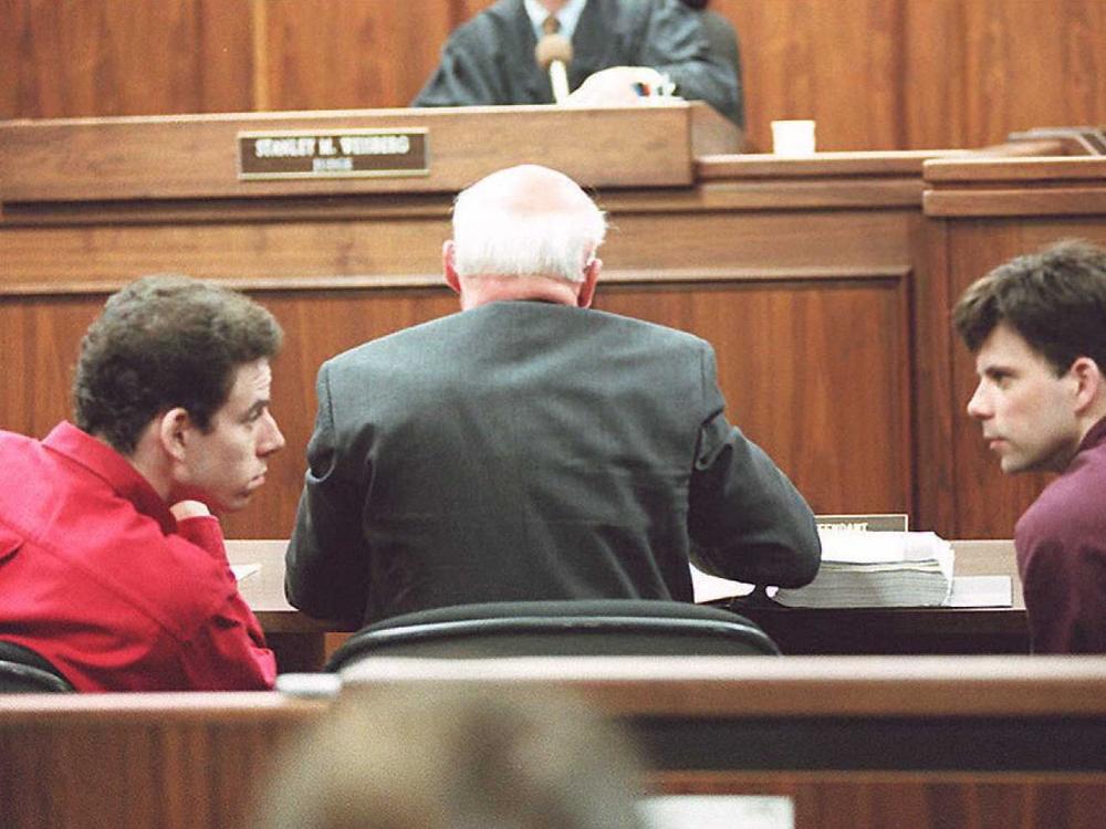 Erik (left) and Lyle Menendez talking in a Los Angeles courtroom on Feb. 2, 1995.