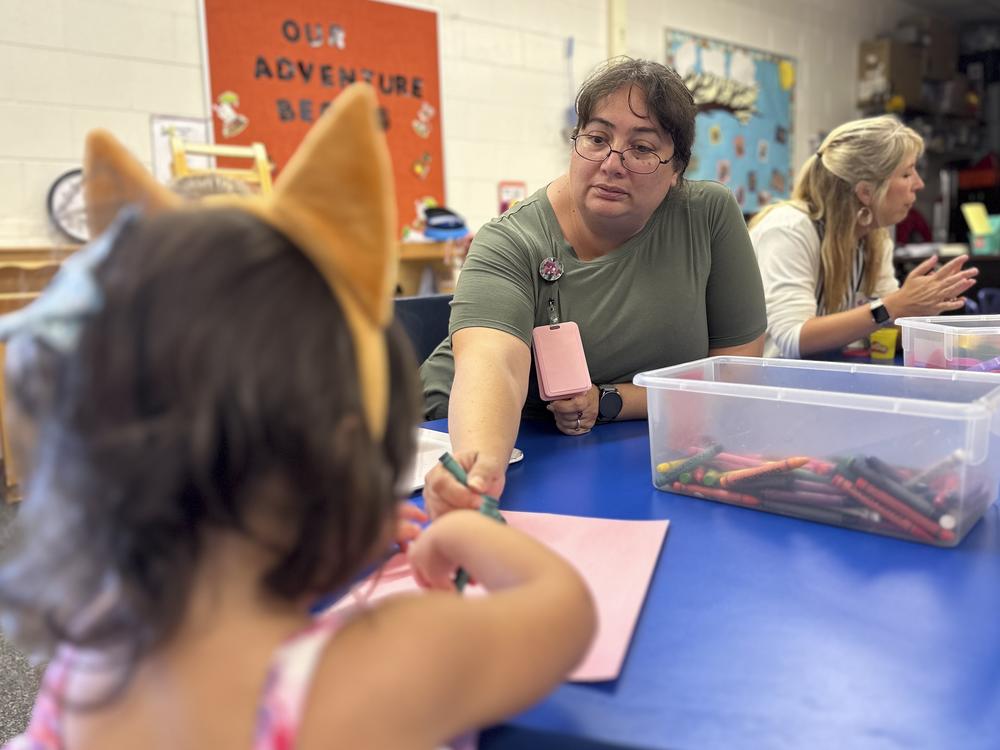 Julie Beck earns roughly $20 an hour teaching in Head Start classrooms 10 months a year. “I'm paycheck to paycheck,” she says.