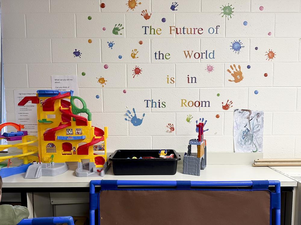 An inspirational message decorates the wall of Beryl Davis’ Head Start classroom. She makes roughly $26 an hour and says turnover has been a persistent challenge.
