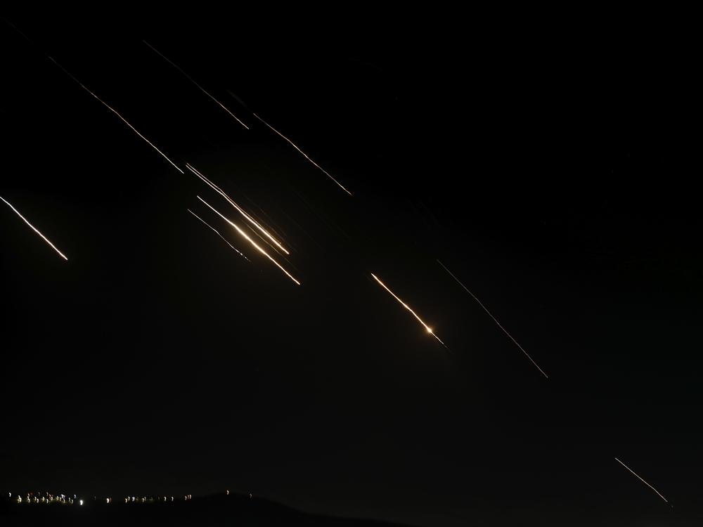 Missiles launched from Iran towards Israel are seen in the West Bank city of Nablus Tuesday, Oct. 1, 2024.