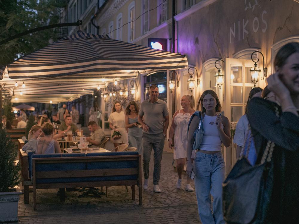 People stroll along one of Odesa's main tourist streets on the evening of Aug. 14, where it's hard to find an empty table at the restaurants.