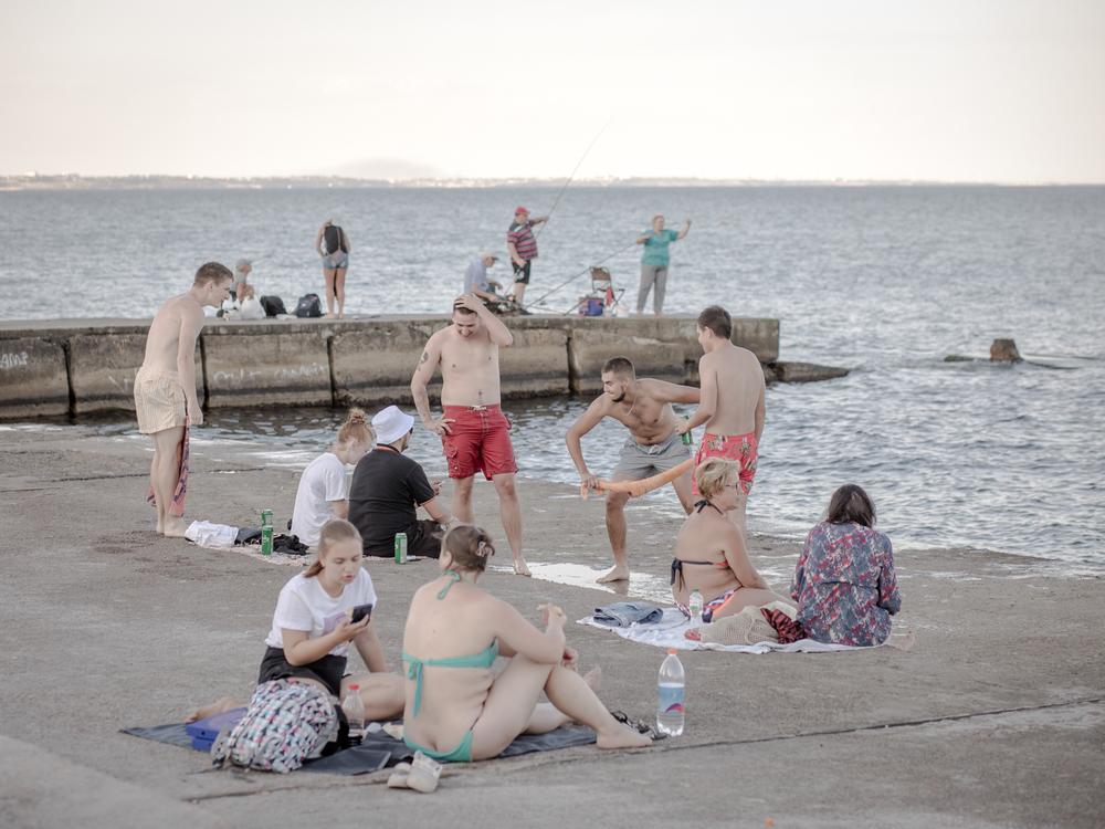 Odesa's beaches are often so crowded that people also spread out onto the nearby concrete 