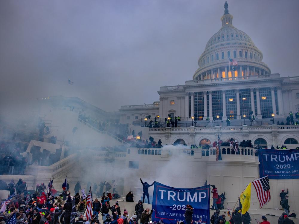 Tear gas drifts over the crowd outside the U.S. Capitol on Jan. 6, 2021.