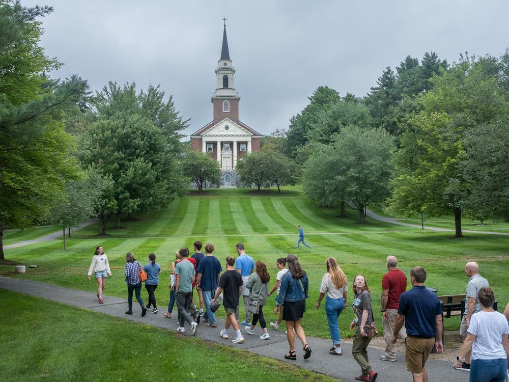 Student Catherine Mongan guides a tour for families visiting Colby College.