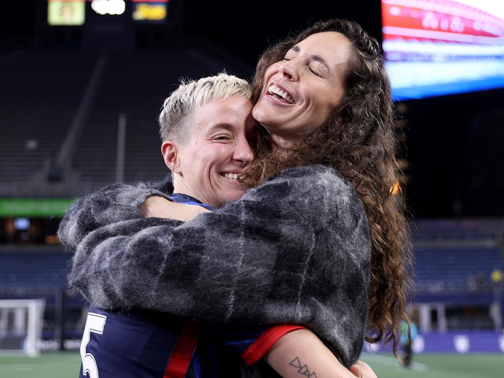 Megan Rapinoe hugs her partner Sue Bird after her last home regular-season NWSL match at Lumen Field on October 06, 2023 in Seattle, Washington