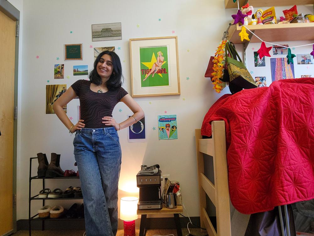 Second-year student Isha Mehta shows off the Mel Ramos lithograph on the wall of her dorm room. An Economics and human rights major, Mehta says the program has made her more interested in learning about art and attending Smart Museum exhibits.