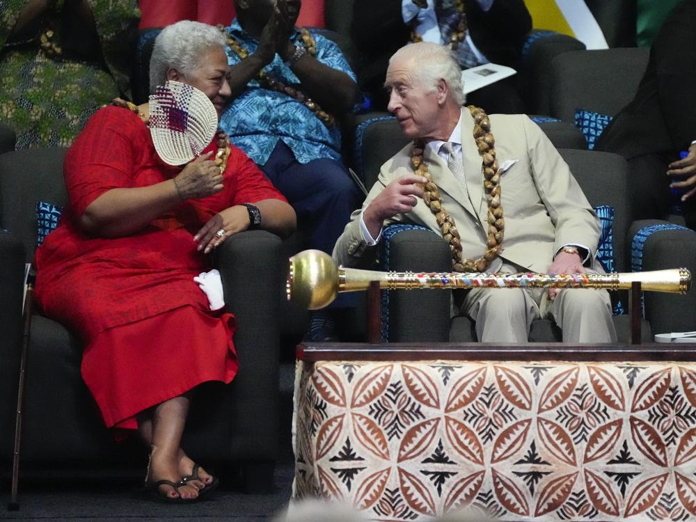 Britain's King Charles and Samoan Prime Minister Afioga Fiamē Naomi Mataʻafa, left, talk during the opening ceremony for the Commonwealth Heads of Government meeting in Apia, Samoa, Friday.