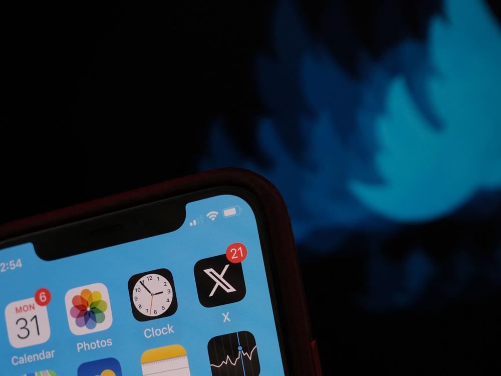 The X logo on a smartphone screen. Since taking over the social media site, Musk has become the loudest voice on the platform and increasingly used it to promote his political views.