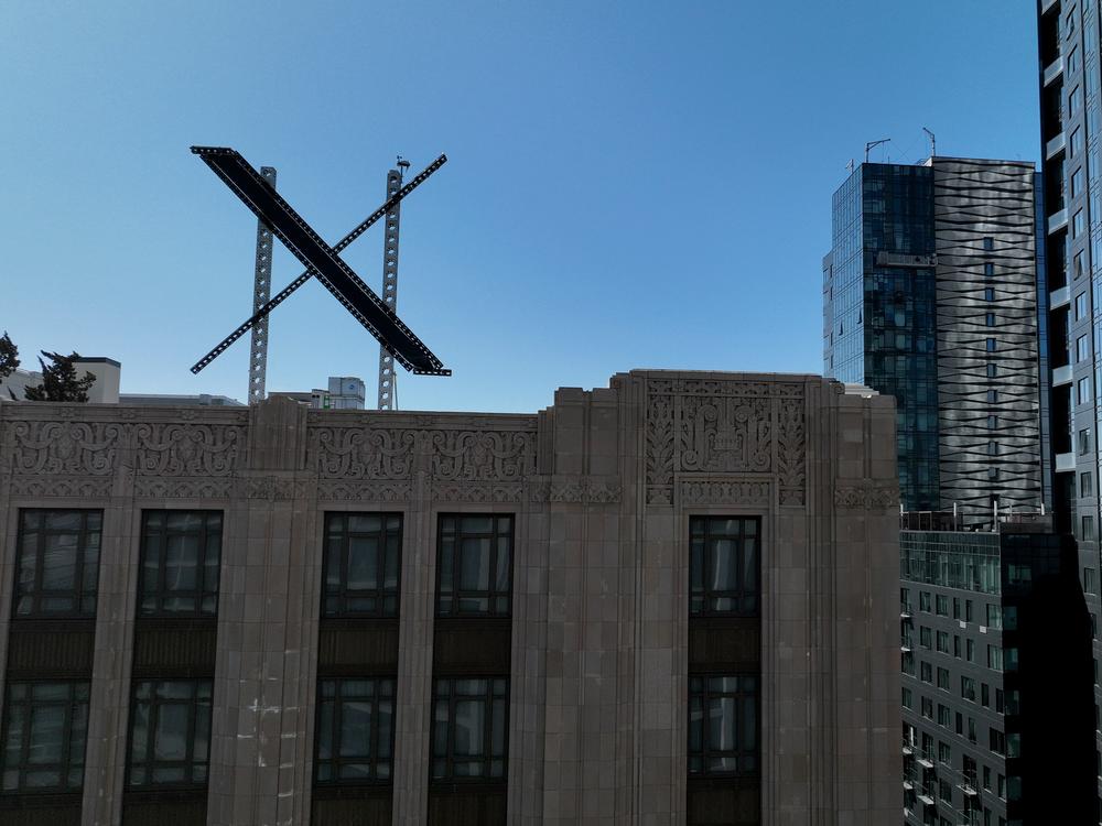 A large X logo on the roof of X (formerly Twitter) headquarters on July 31, 2023, in San Francisco. Musk has since announced that the company's headquarters are moving to Texas.