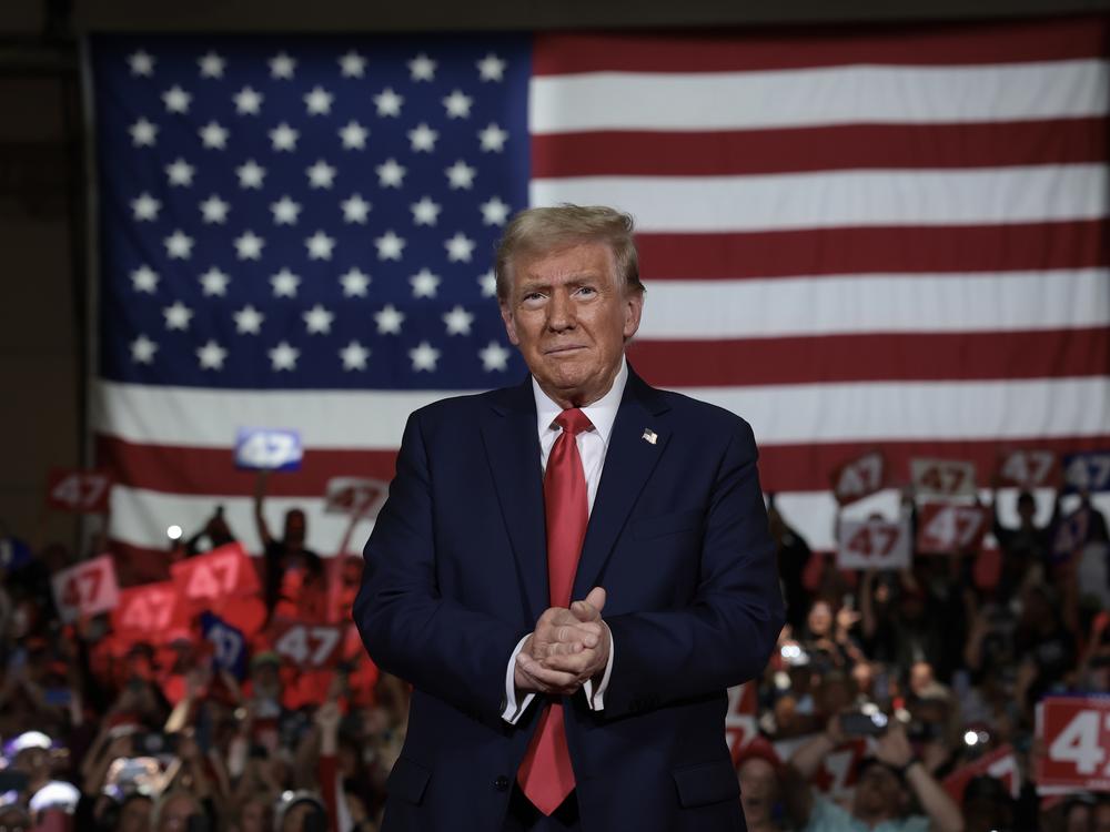 Republican presidential nominee, former President Donald Trump, arrives on stage during a town hall campaign event at the Lancaster County Convention Center on Oct. 20 in Lancaster, Pa.