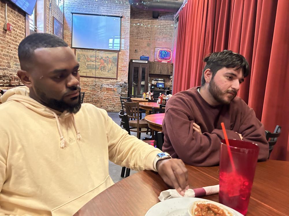 Adrian Consonery, Jr., and Brian Ramirez were part of a group of grassroots organizers that NPR met with at Manuel's Tavern in Atlanta on Oct. 22, 2024.
