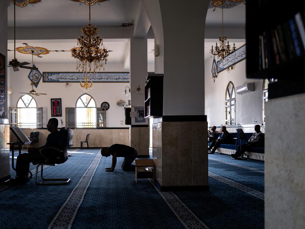Men pray inside Jabalieh Mosque in Jaffa. Many Palestinian citizens of Israel come here to ease their pain over the war in private.