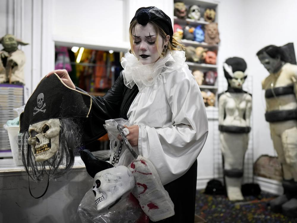 Olive Luther prepares to stock costume displays at The Theatrical Shop, Tuesday, Oct. 29, 2024, in West Des Moines, Iowa.