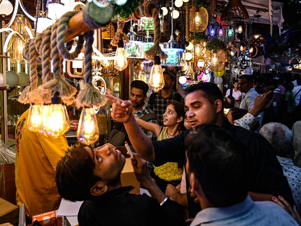 A huge crowd was seen at Bhagirath Palace on Oct. 27 in New Delhi, India, shopping for lights and lamps ahead of the Diwali Festival. The holiday is celebrated with many traditions and symbols.