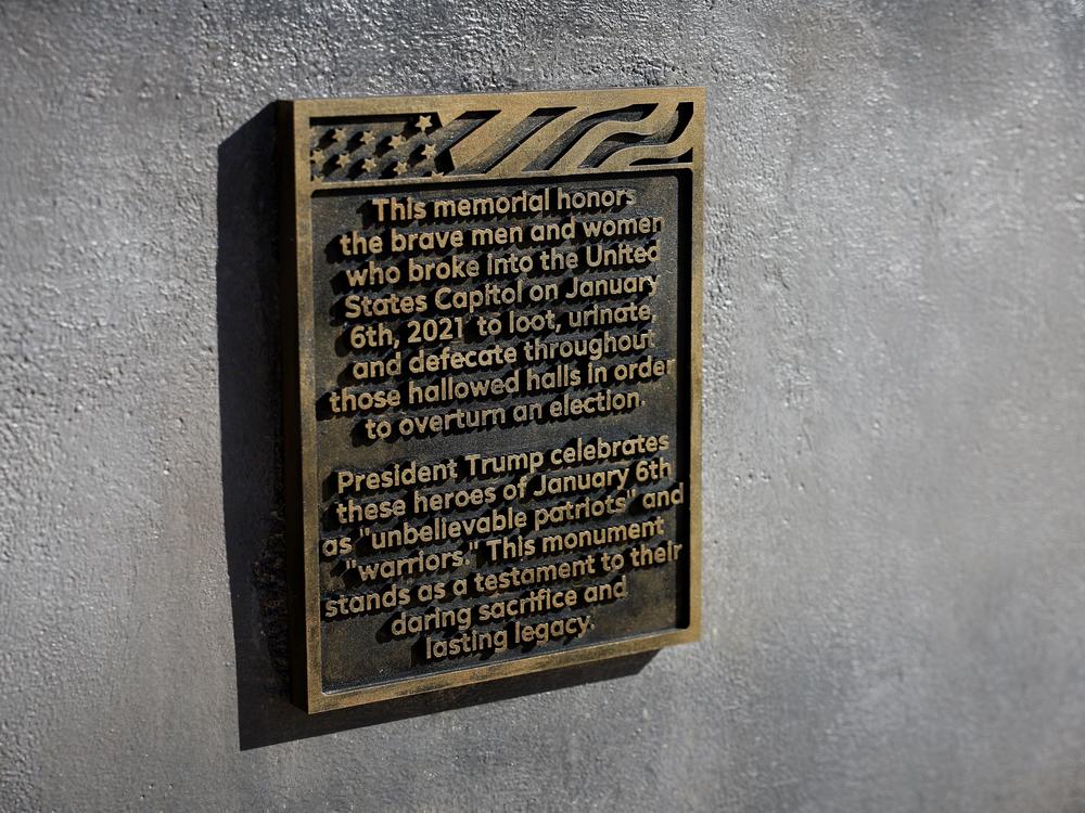 The plaque on the desk sculpture pays what appears to be a mocking tribute to the people who stormed the Capitol on Jan. 6.