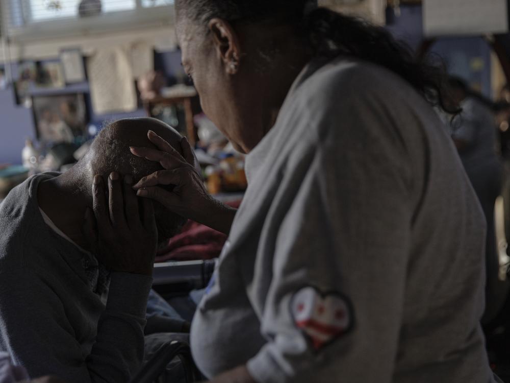 Pat Haskins cares for her partner, James Harris, who has suffered greatly from diabetes and uses a wheelchair.
