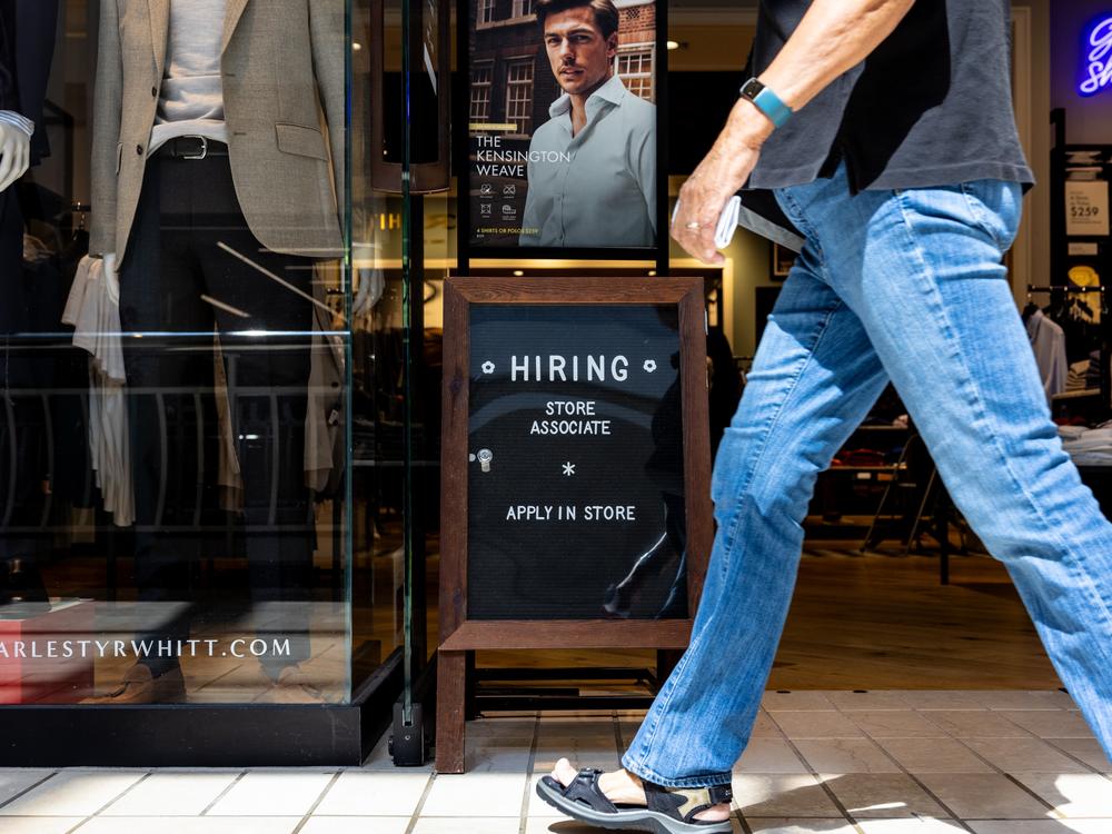 A hiring sign is displayed in front of store at the  Charles Tyrwhitt at the Tysons Corner Center mall on August 22, 2024 in Alexandria, Virginia. The U.S. labor market remains healthy, with employers added more than a half-million jobs during the July to September quarter.
