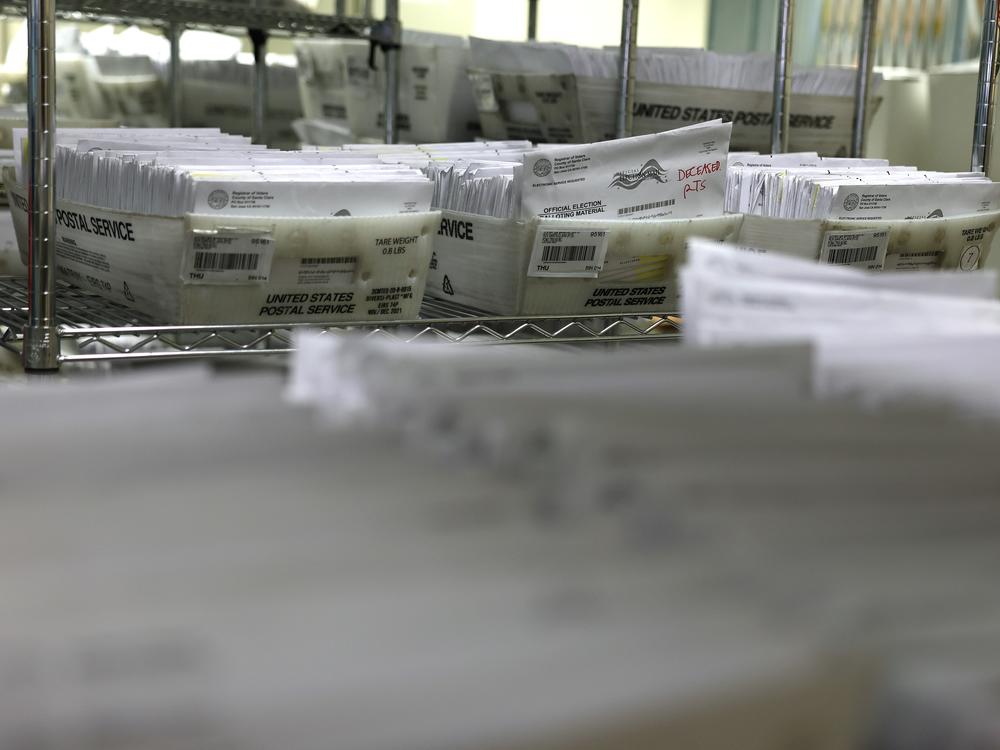 Trays of mail in ballots are stacked at the Santa Clara County Registrar of Voters office on Oct. 21, 2024 in San Jose, Calif.