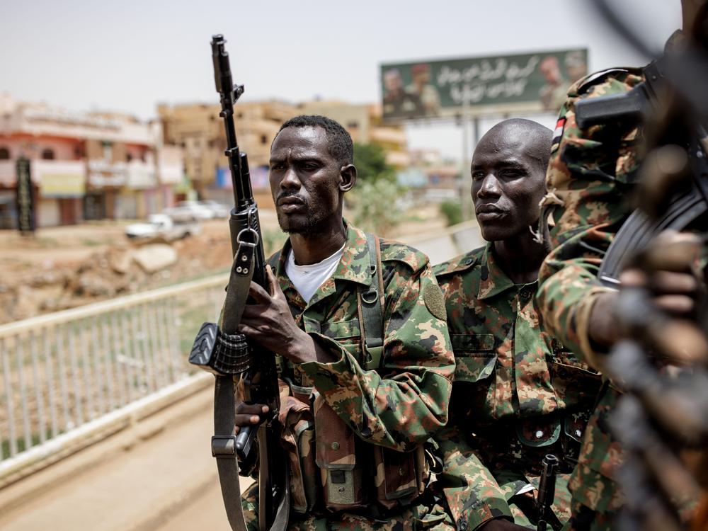 Sudanese Armed Forces soldiers travel to Khartoum in the back of a Toyota pickup truck in Omdurman, Sudan, on Sept. 7.