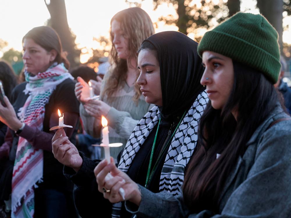 Pro-Palestinian supporters hold a candlelight vigil in Dearborn, Mich., on the first anniversary of the Oct. 7 Hamas-led attacks in Israel and the ongoing war in Gaza.