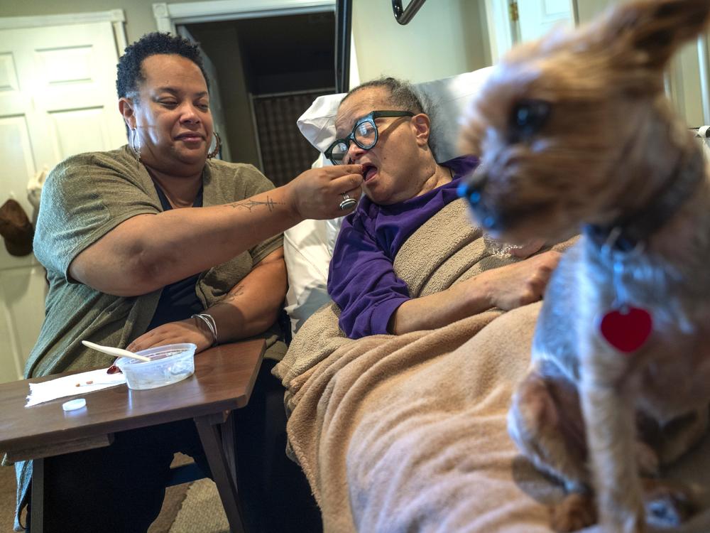 Dawn Shedrick, left, is one of roughly 106 million unpaid caregivers in the U.S. For 30 years, Shedrick taken care of her mother, Nathalia Shedrick, right, who has multiple sclerosis.