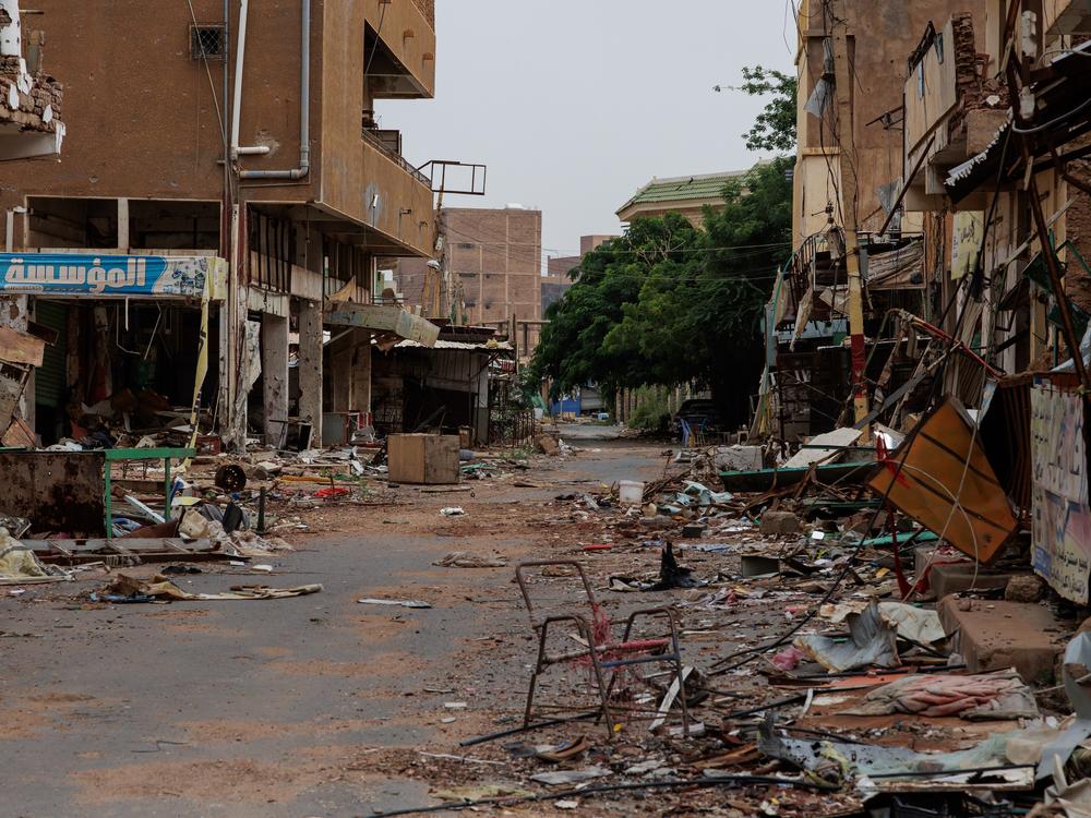 A street running through the Souq Omdurman market is strewn with debris from fighting, in Omdurman, Sudan, on Sept. 7.