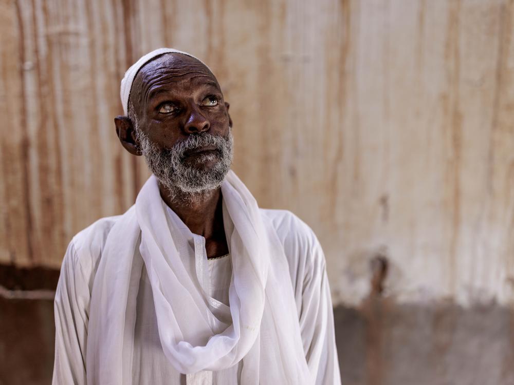 Mohammed Khair, 64, poses for a portrait at his home in old Omdurman, Sudan, on Sept. 6.
