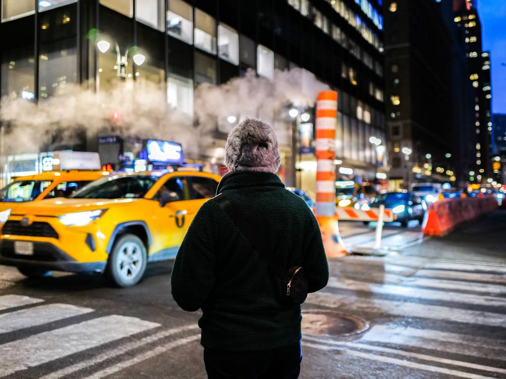 A person waits to Lexington Avenue in Manhattan on Feb. 21.