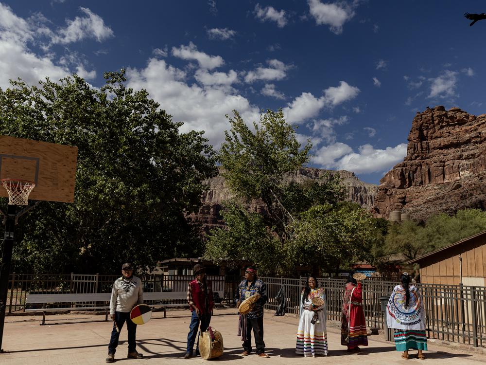 Community members prepare to perform a traditional dance at the Supai Tribe village.