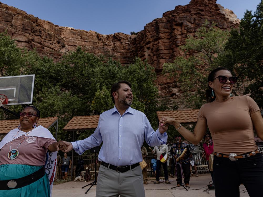 Arizona Democratic Rep. Ruben Gallego (center) joins community members in a traditional dance at the Supai Tribe village in the Grand Canyon on Oct. 14.