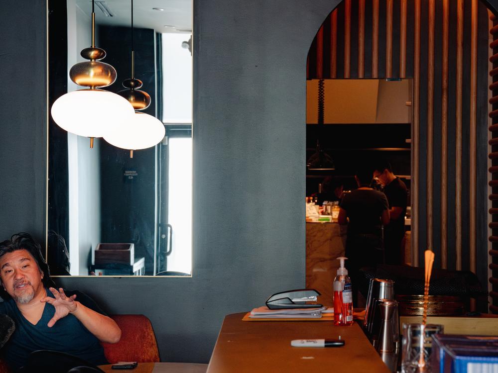 Lee speaks to a reporter inside his restaurant, Shia.