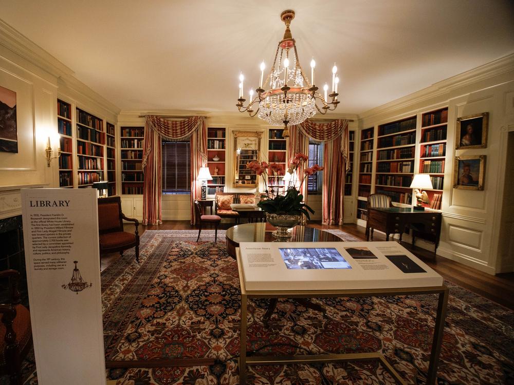 The library of the ground floor, along with an information board.