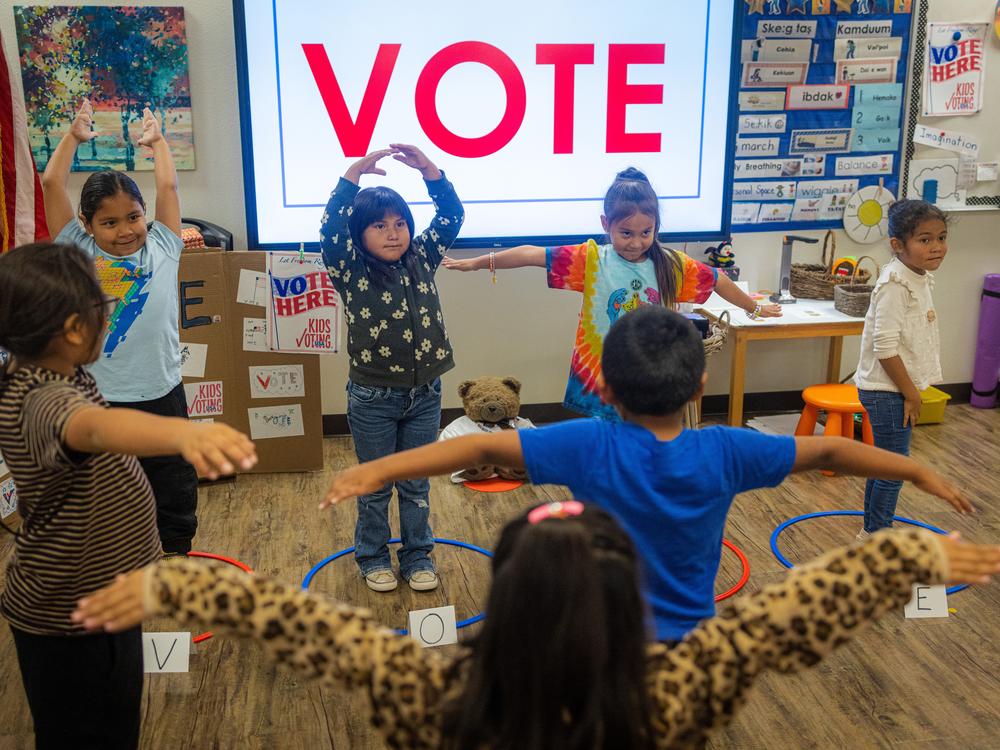 Meyers’ kindergartners practice spelling the word “vote” with their bodies.