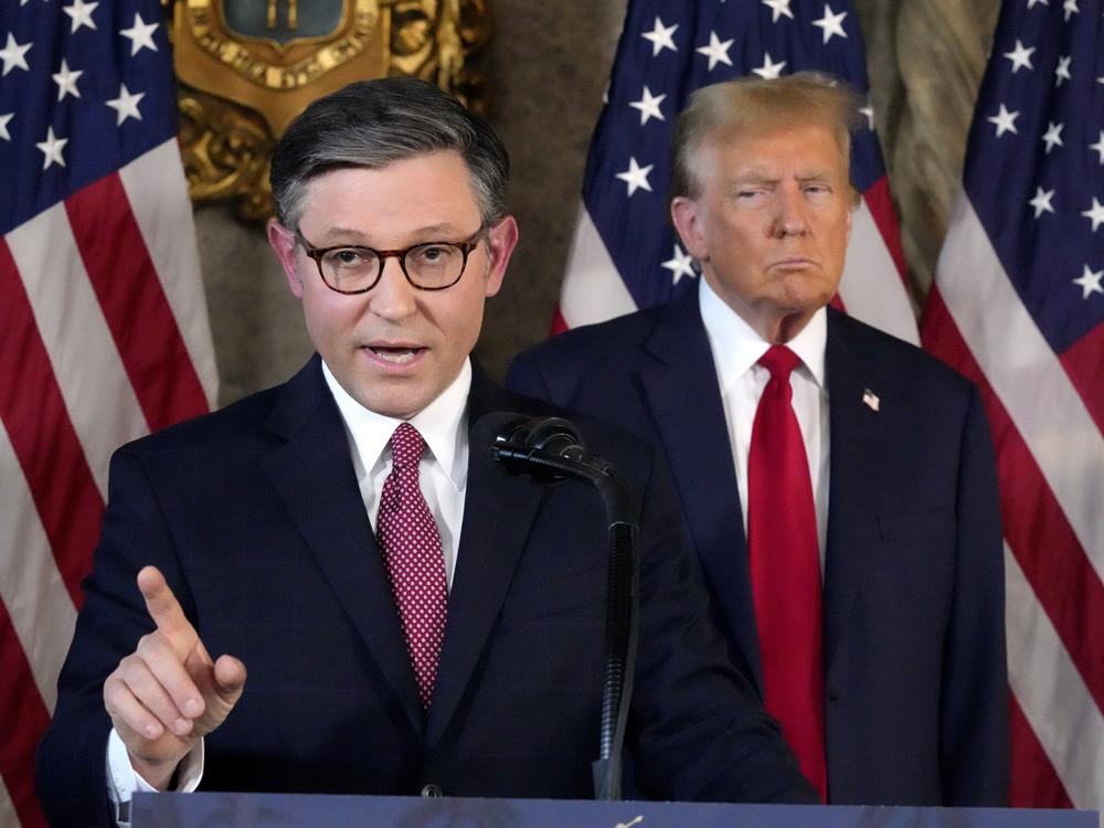 Speaker of the House Mike Johnson, R-La., speaks as former President Donald Trump listens during a news conference, April 12, 2024, at Mar-a-Lago in Palm Beach, Fla. Johnson promised recently that if they gain control in Congress, Republicans' agenda includes 