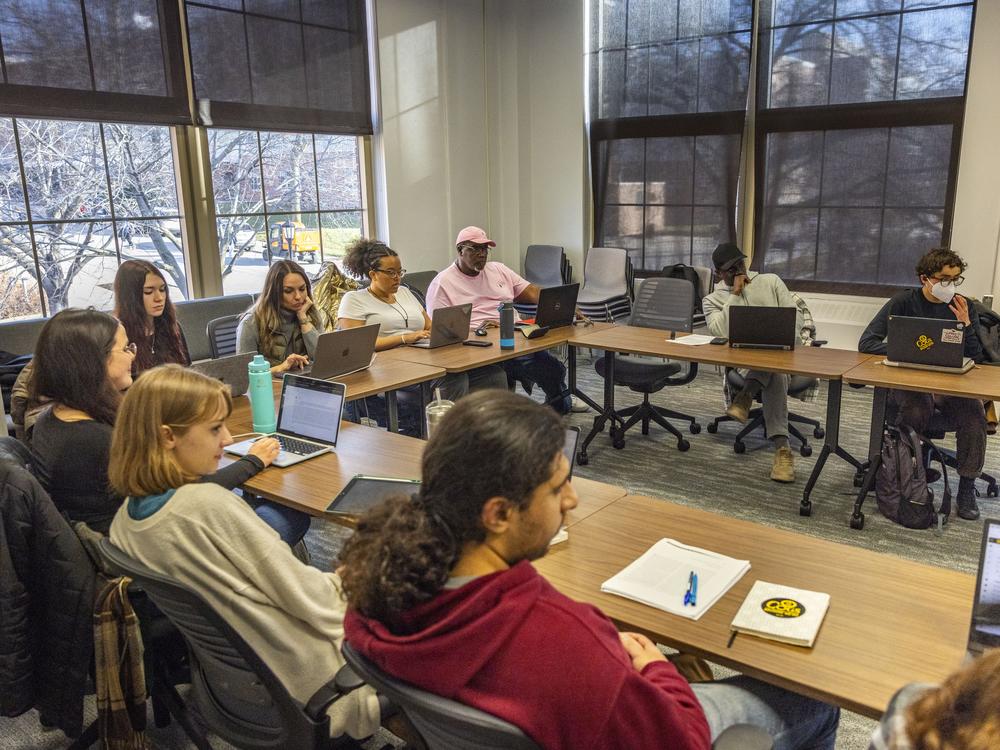 Dell Pippins and his cohorts listen during a class in North Hall at the University of Iowa in Iowa City on Wednesday, Dec. 6, 2023. Pippins is pursuing a doctorate in sociology in Iowa after obtaining a master’s degree in statistical science from the University of Idaho, studying remotely from prison.