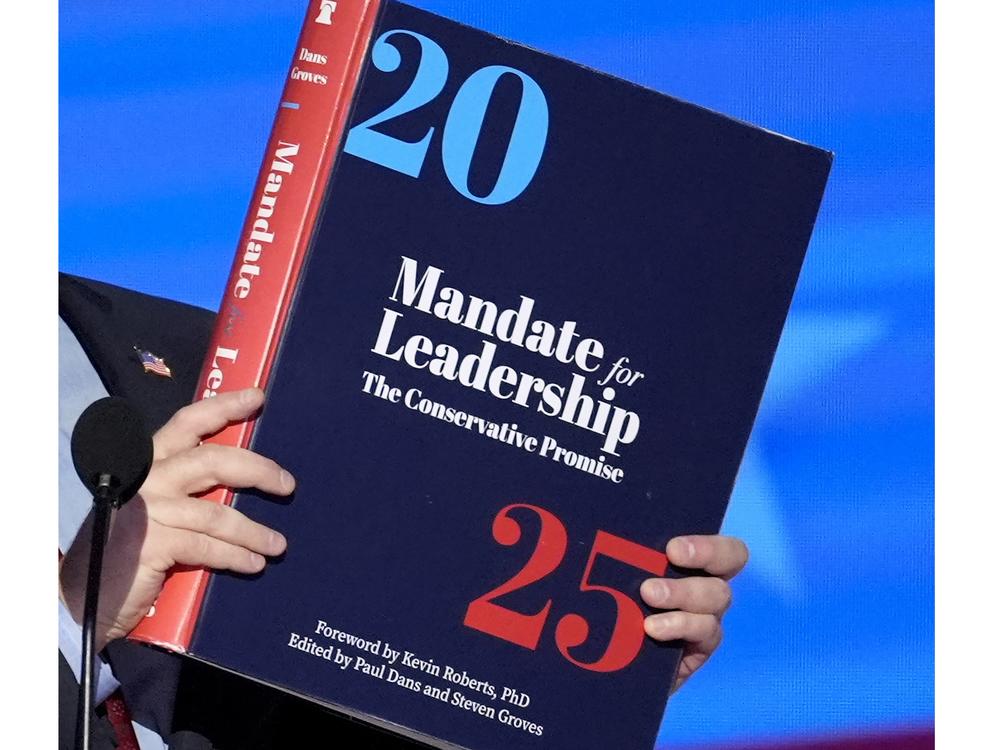 A copy of Project 2025 is held during the Democratic National Convention in August.