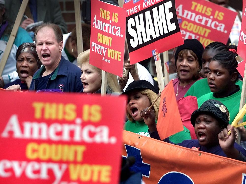 Dec. 13, 2000:  Supporters of Democratic presidential candidate Al Gore march to the Florida State Capitol to rally against the legislature's intention to name a slate of electors favorable to Republican presidential candidate George W. Bush.