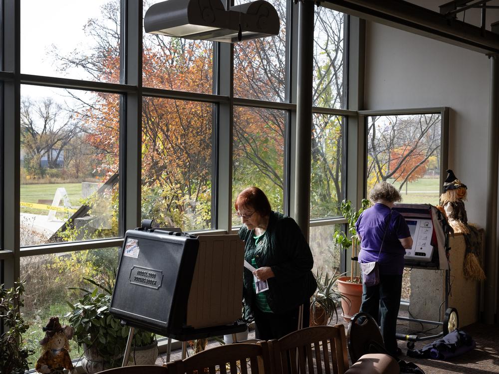 Residents cast in-person absentee ballots at a polling place set up at the Warner Park recreation center on October 30, 2024 in Madison, Wisconsin.