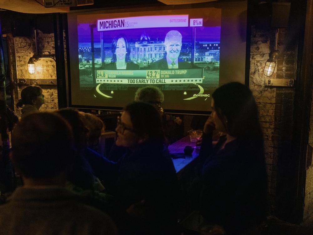 Jackson Heights residents anxiously look on for the evening’s election results during an election night watch party at Terraza 7.