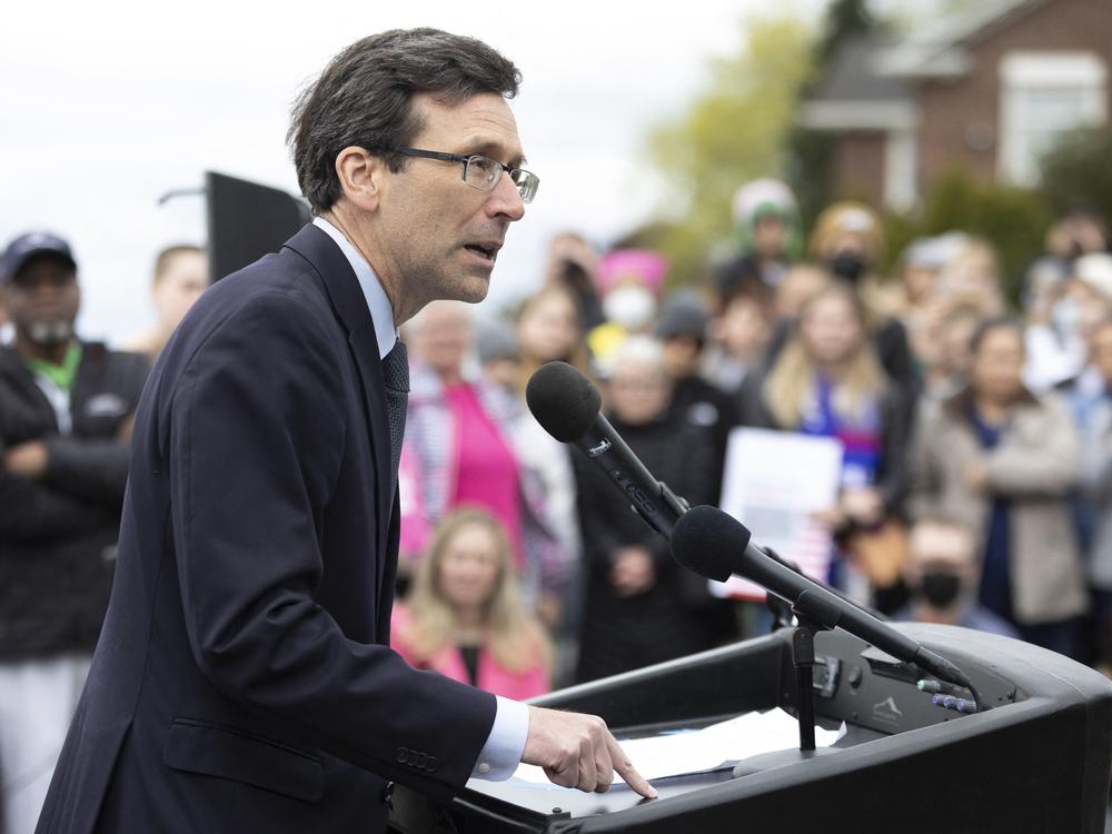 Washington state Attorney General Bob Ferguson speaks to media and people gathered at Kerry Park in 2022.