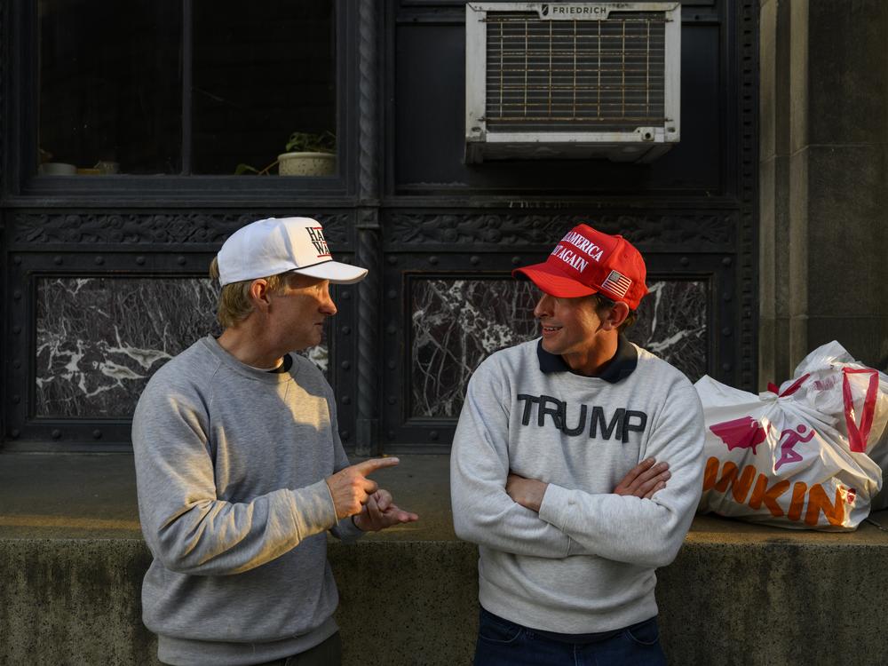 Supporters of both presidential candidates, Vice President Kamala Harris and former President Donald Trump, have a conversation on October 29, 2024 in Pittsburgh.