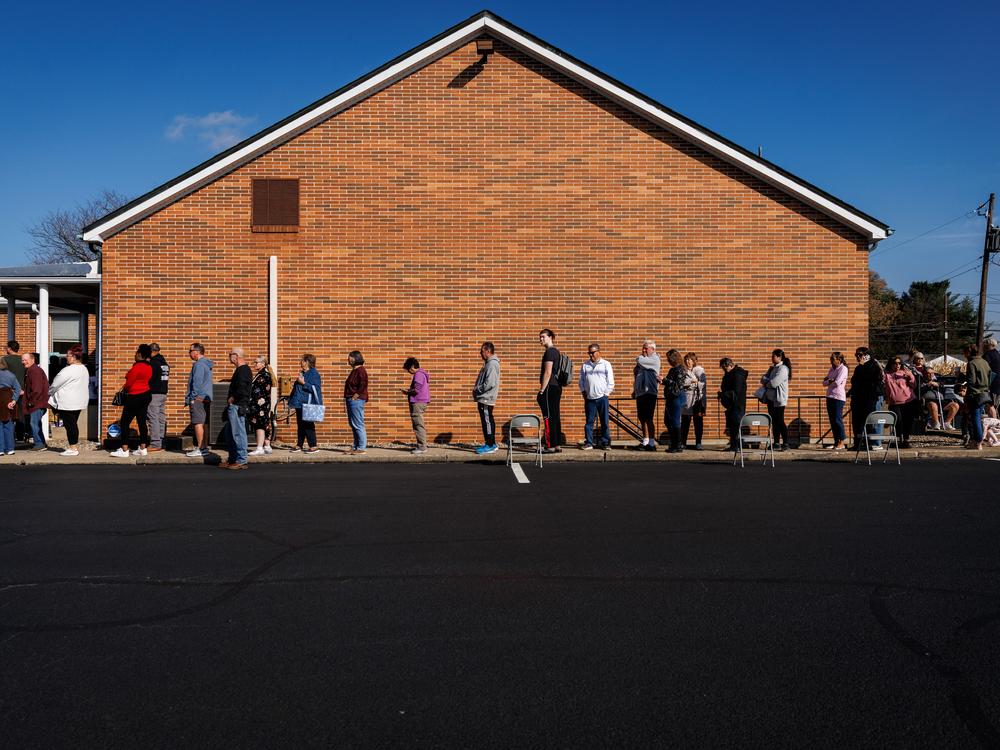 People wait in line to vote outside a polling station at the Dryland United Church of Christ in Nazareth, Pa., on Tuesday.