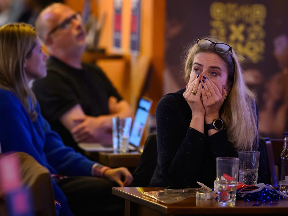 Supporters of U.S. Vice President Kamala Harris react as results are displayed during a Democrats Abroad election party on Wednesday in London, England.