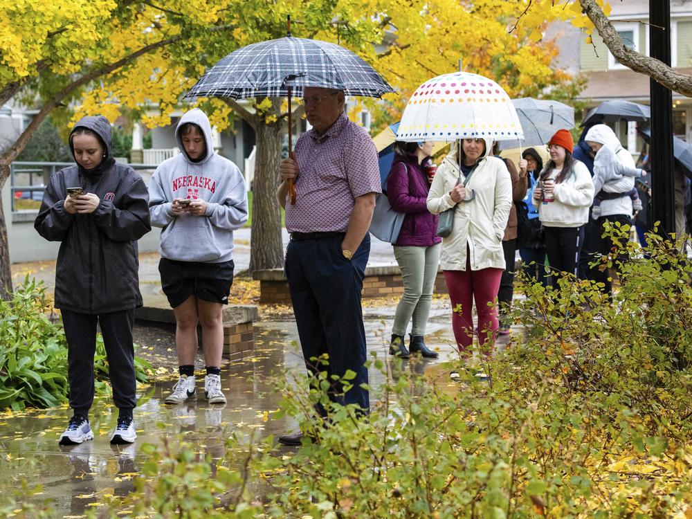 Voters line up to cast their ballots at Dundee Elementary School in Omaha, Neb., on Election Day, Tuesday, Nov. 5, 2024.
