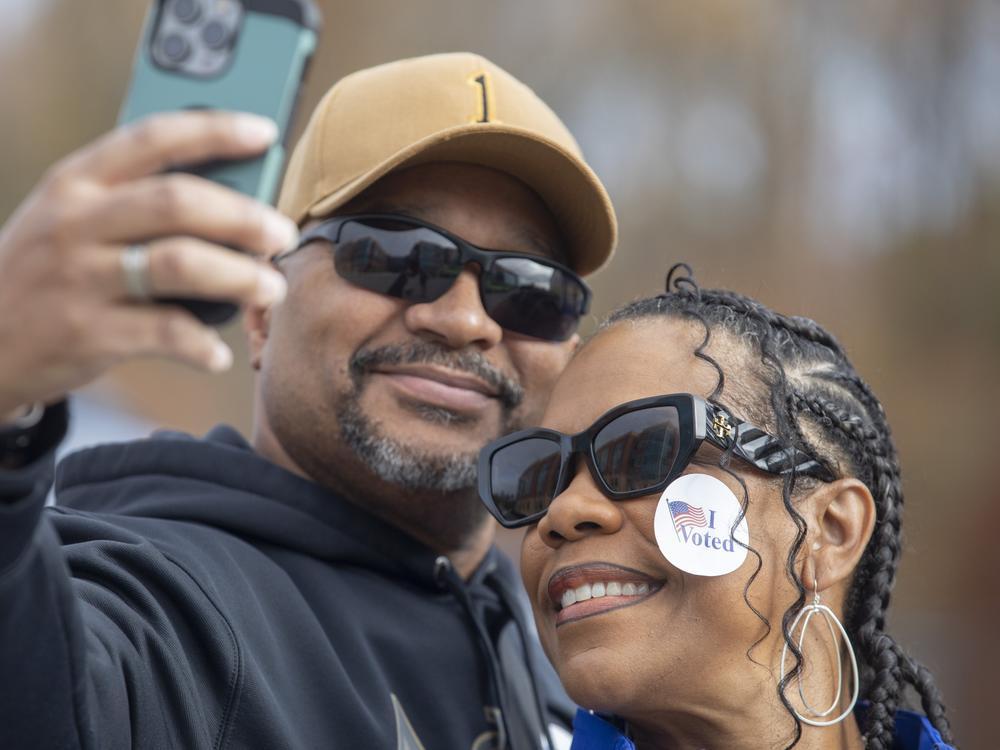 Iris and Burt Foster take a selfie after voting Dr. Henry A. Wise, Jr., High School in Upper Marlboro, Md.